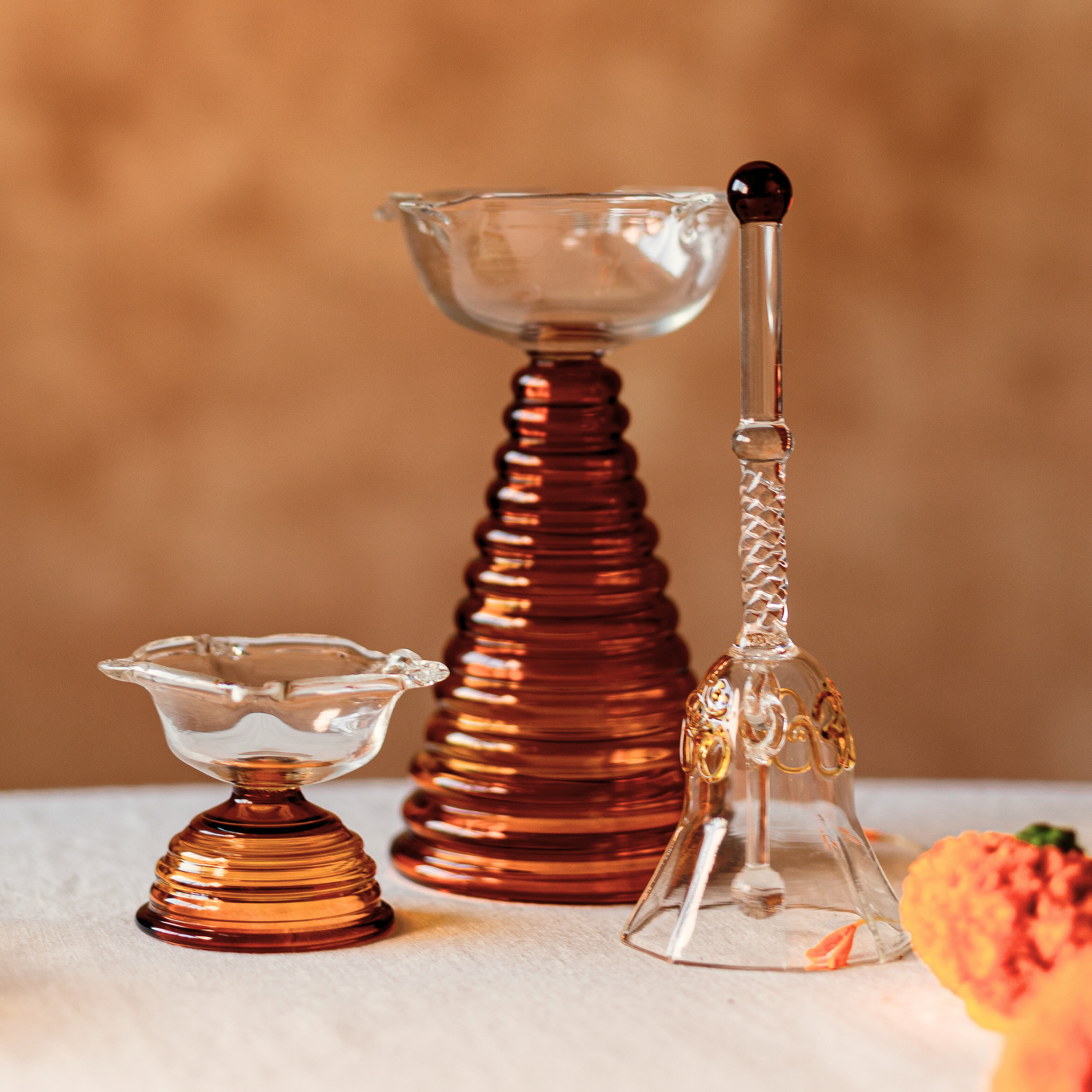 Combination of Amber Glass Bell and Glass Diya 